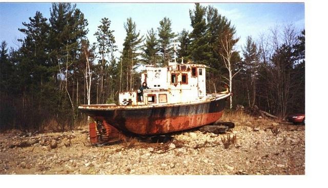 An old tug hauled out on dry ground (undated scan)