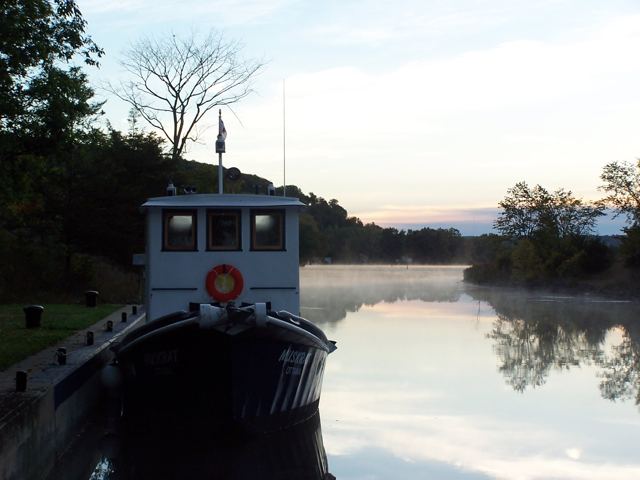 Early morning at a lock wall, mist on the water