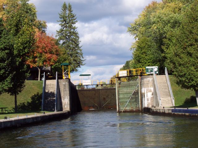 A lock ahead, autumn colour on the trees