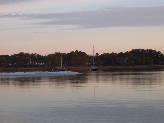 Sailboats at anchor at dusk