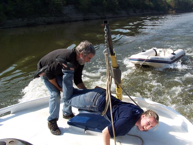 Working on the foredeck, dinghy in tow