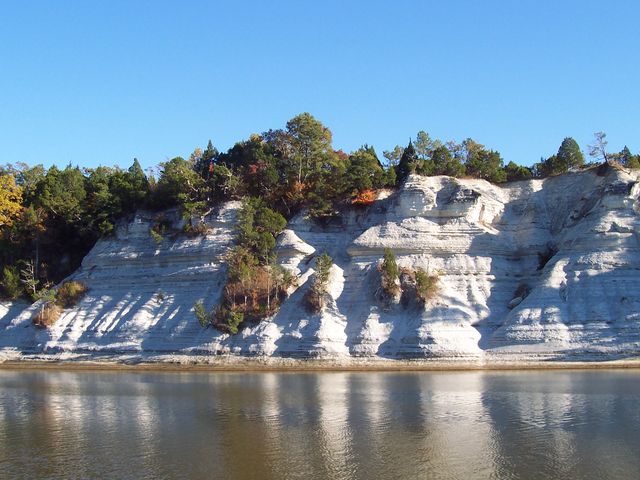 White chalk bluffs reflected in the river
